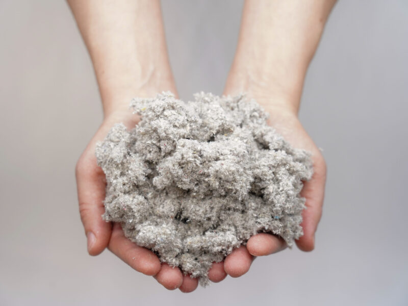 Hands,Holding,Cellulose,Fiber,For,Ecological,Insulation,Of,The,House.